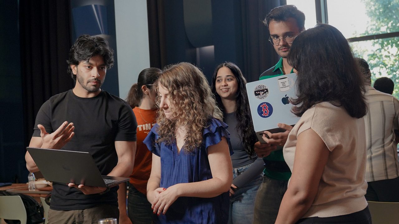 The Altair team demoing the project on a laptop to a judge